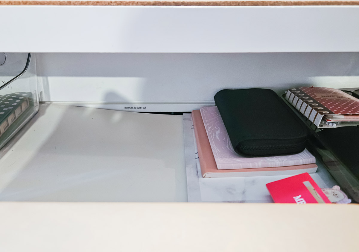 A sagging Ikea Micke desk 
drawer